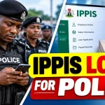 Nigerian police officer checking an IPPIS loan application on a smartphone
